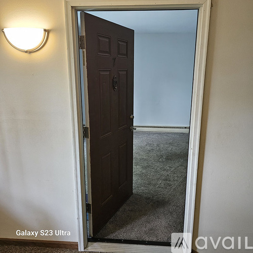 A door is open to a hallway.