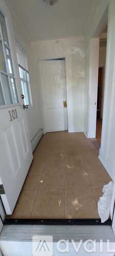 A room with a door and a window is being renovated.