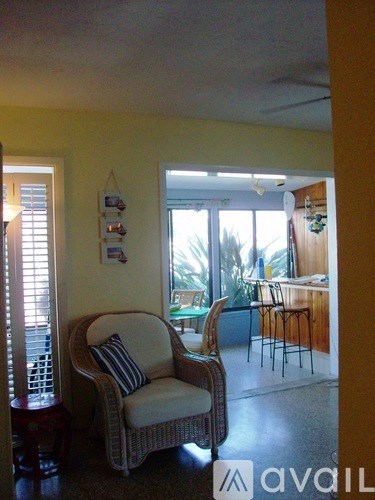 A living room with a chair and a table.