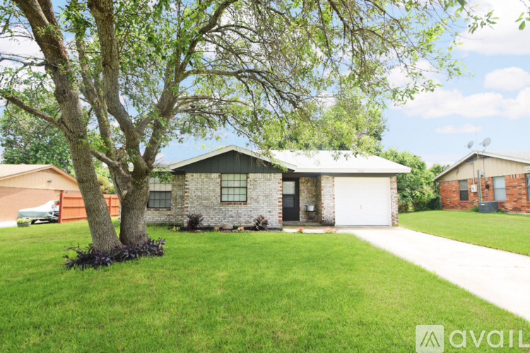 A house with a garage is available for sale.