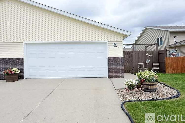 A house with a white garage door and a driveway.