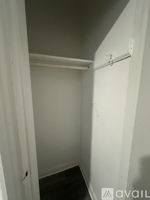 A white door with a white wall behind it.