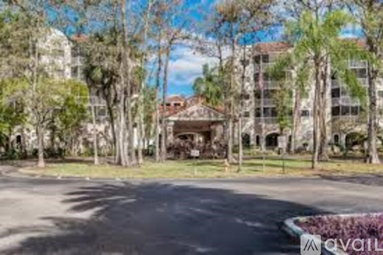 A large building with a tree in front of it.