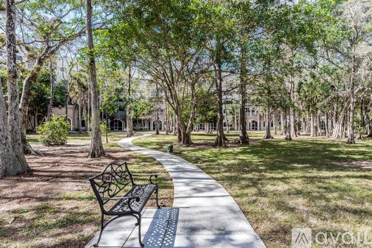 A park with a bench and a pathway.