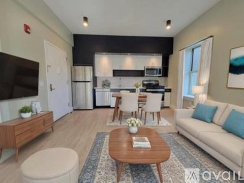 A modern living room with a wooden coffee table and a white sofa.
