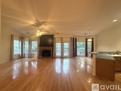 A kitchen with wooden cabinets and a white refrigerator.
