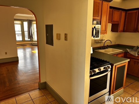 A kitchen with a stove and a sink.