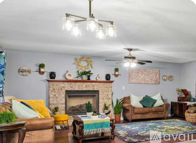 A house with a garage and a driveway is for sale.