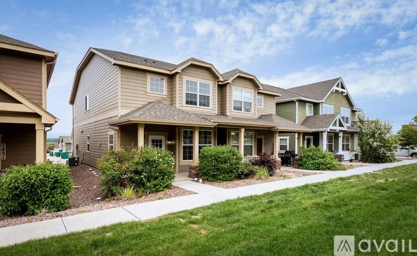 A row of houses with the middle one being the most prominent.