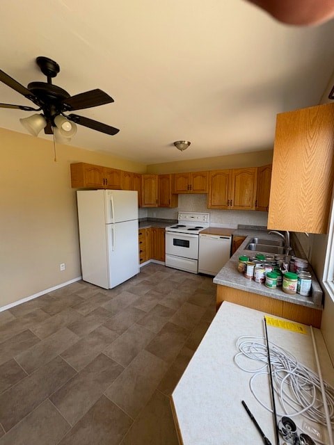A kitchen with a white fridge and a white stove top oven.