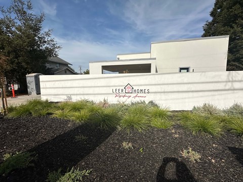 A modern building with the name Lee Brathames Lee Brathames on the wall.