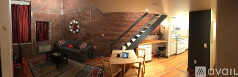 A living room with a couch and a table.