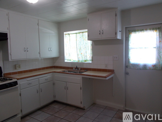 A white fridge and stove in a kitchen.