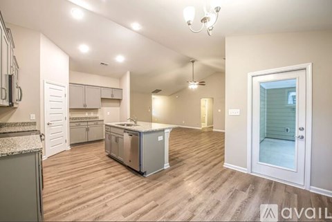 A kitchen with a dishwasher and a refrigerator.