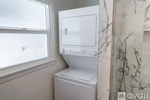 A white dishwasher is installed in a kitchen.