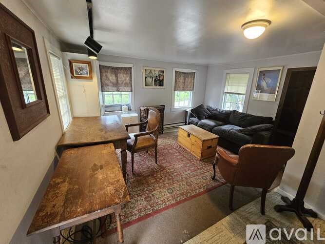 A living room with a couch, chair, and coffee table.