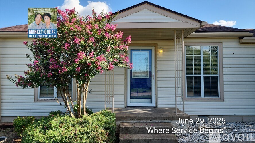 A house with a blue door and a window is shown with the address 2503 Southwest Cornell Avenue.