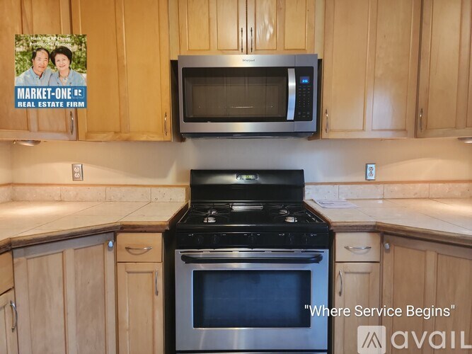 A room with wooden floors and a window with blinds.