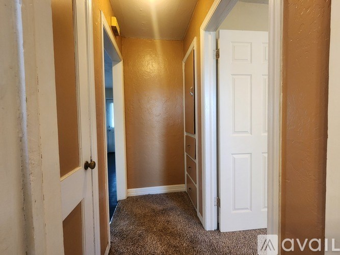 A room with a window and wooden floors is on the market.