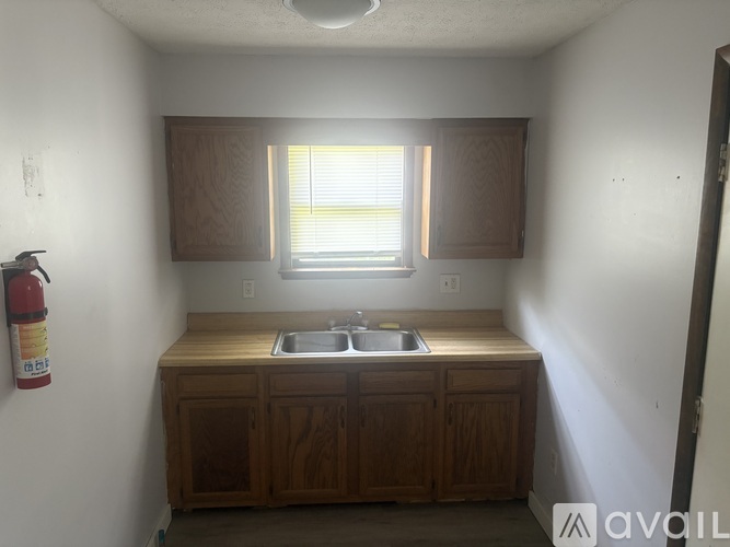 A room with wooden floors and a window.