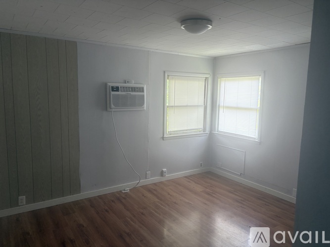 A white fridge and stove in a small room.