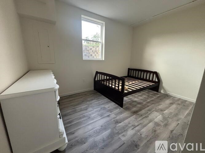 A baby's room with a crib and a dresser.