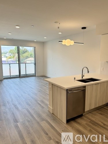 A kitchen with a sink and a window.