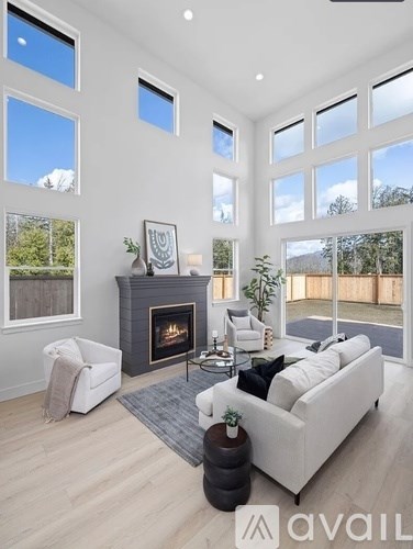 A living room with a fireplace and a couch.