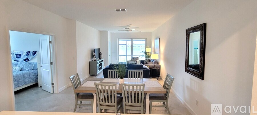 A dining room with a table and chairs is shown.