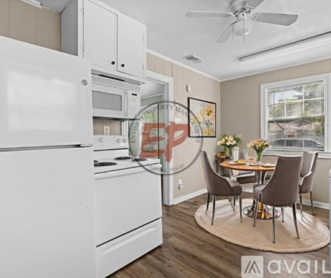 A kitchen with a dining table set for four.