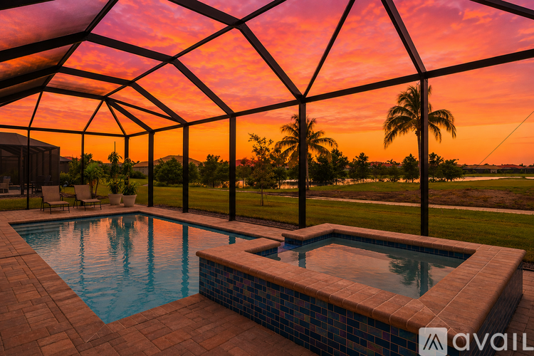 A pool enclosed by a black metal frame with a tiled edge.