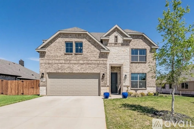 A large house with a garage is for sale.