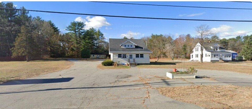 A house with a driveway in front of it.