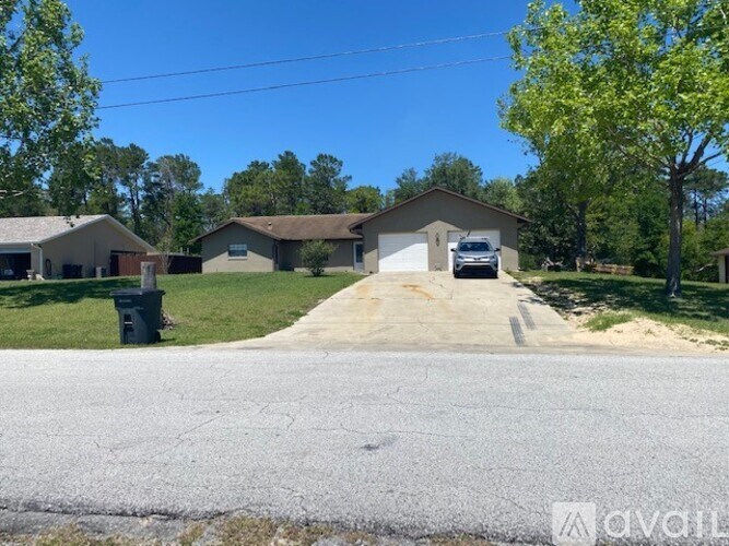 A house with a driveway in front of it.
