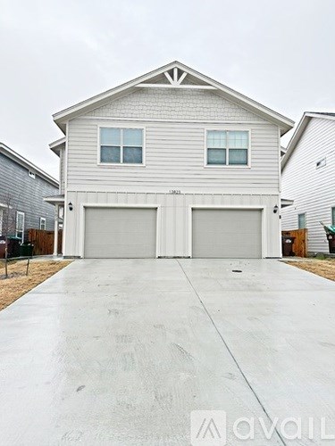 A two-car garage is attached to a house.