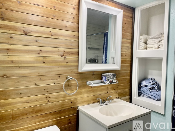 A kitchen with a sink and a window.