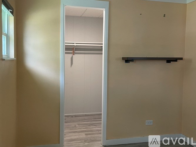A room with a doorway leading to another room.