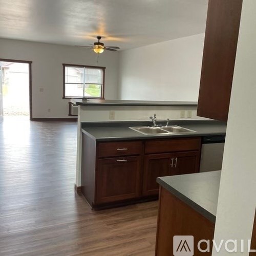 A kitchen with wooden cabinets and a countertop.