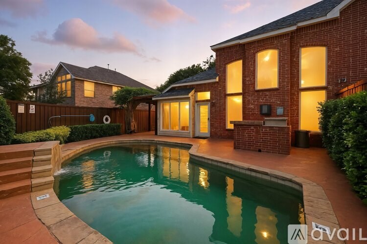 A house with a pool in the backyard.
