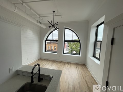 A kitchen with a sink and a window.