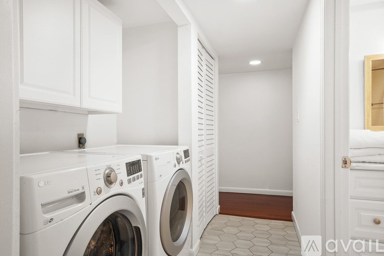 A laundry room with a washer and dryer.