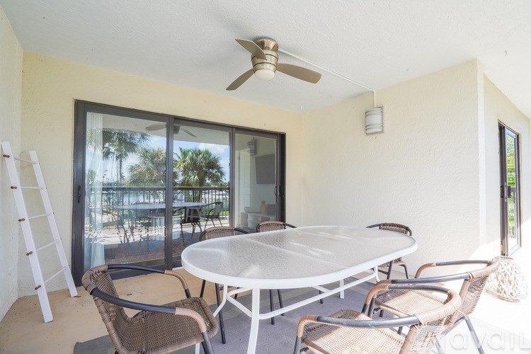A patio with a table and chairs is shown.