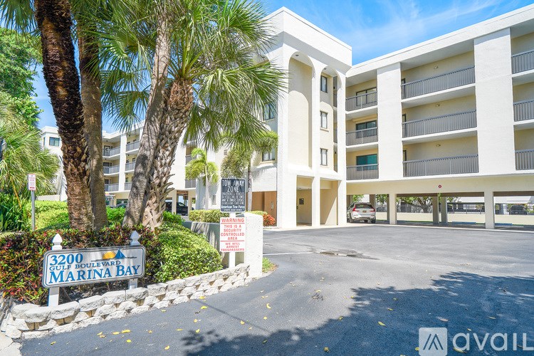 A building with a sign that says Marina Bay in front of it.