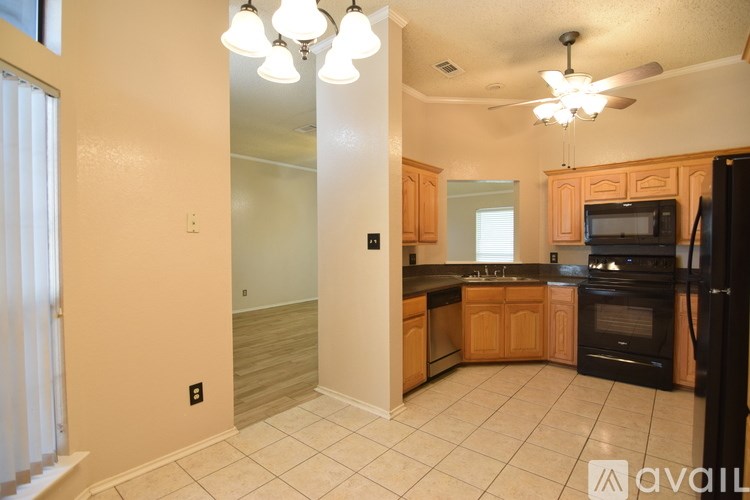 A room with wooden flooring and a window.