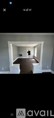 A room with a white door and a window.