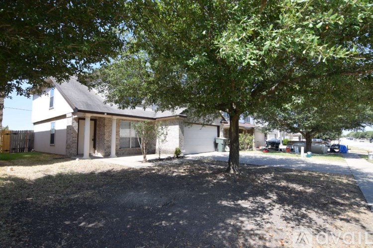 A house with a tree in front of it.