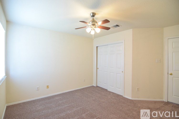 A house with a fence in front of it is for sale.