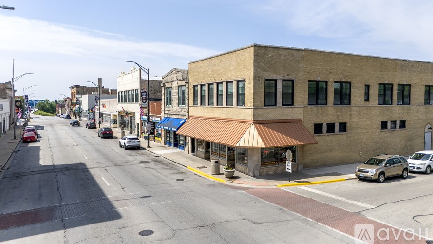 A street view of a city with cars and buildings.