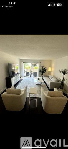 A living room with a grey couch and a coffee table.