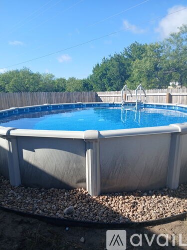 A small above ground pool with a ladder.